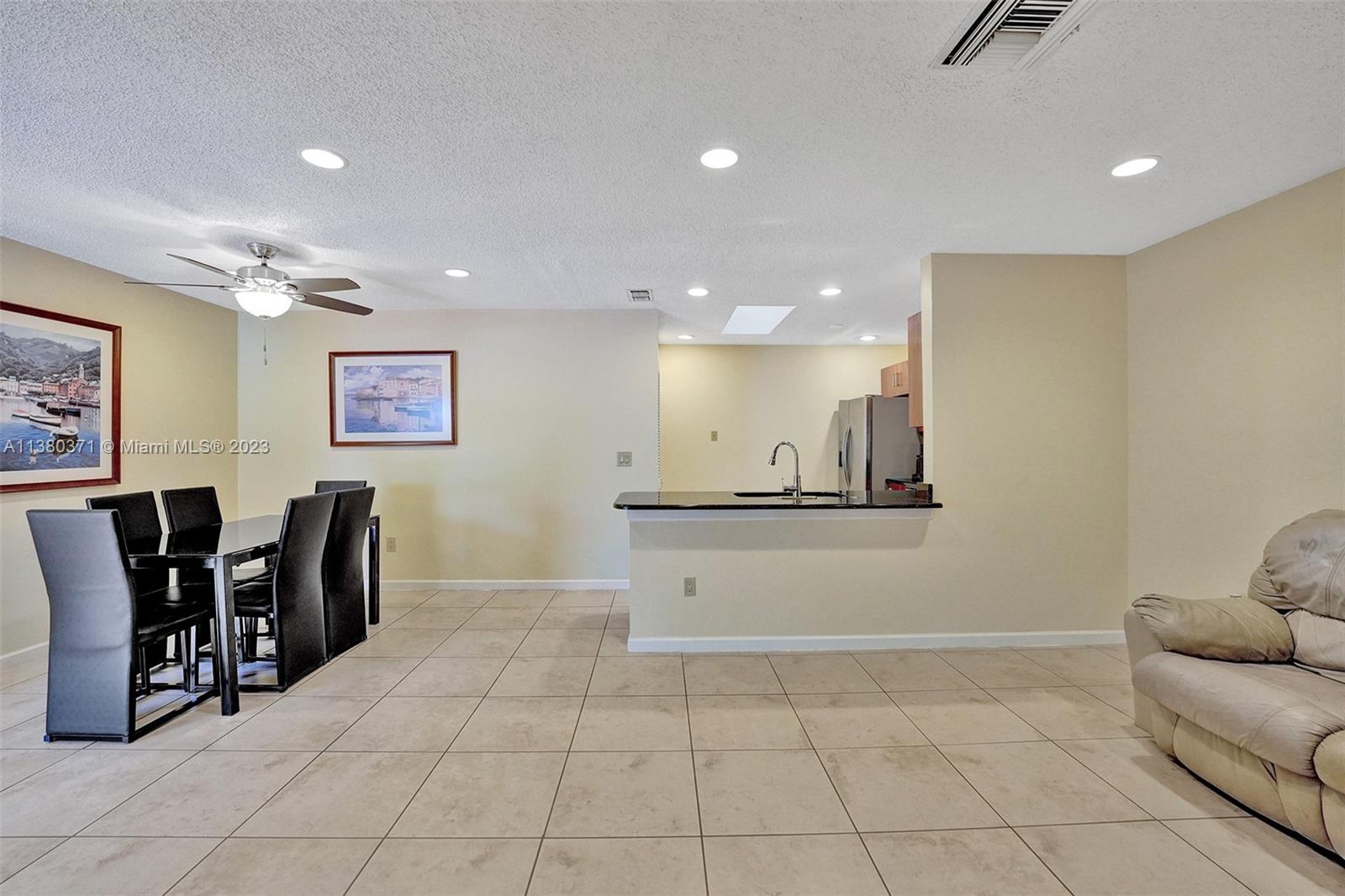 23360 Southwest 53rd Avenue, Unit E Boca Raton, FL 33433 - Photo 12 of 37 a view of kitchen with windows