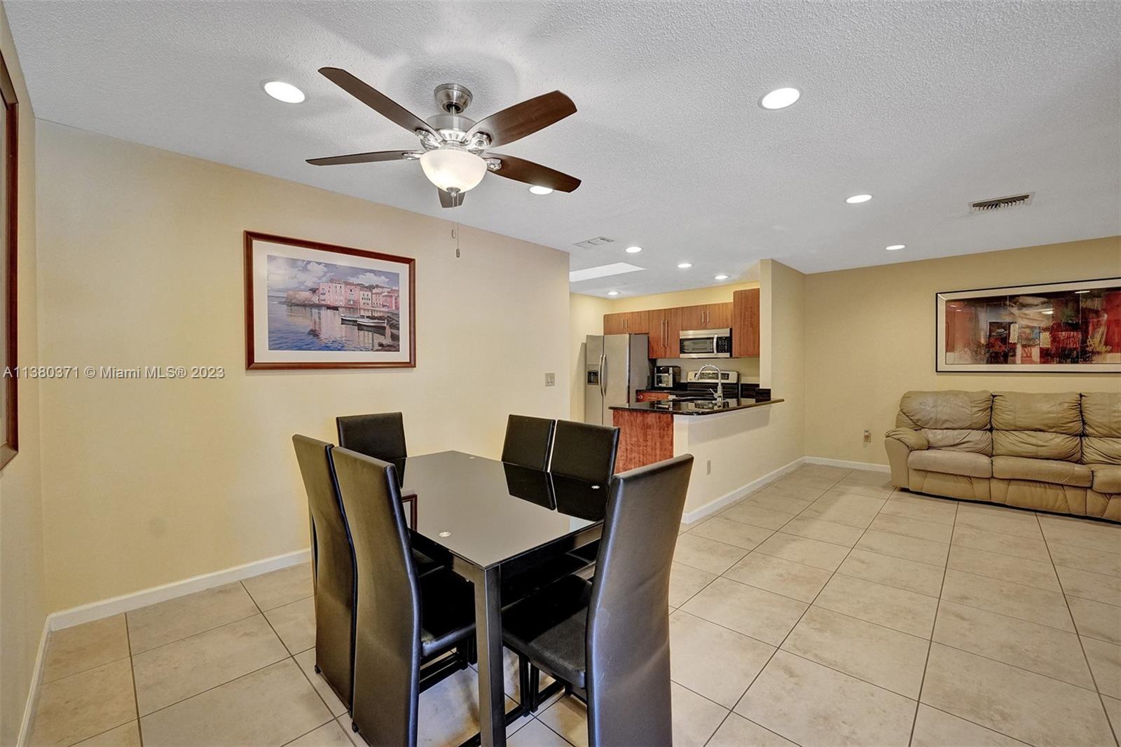 23360 Southwest 53rd Avenue, Unit E Boca Raton, FL 33433 - Photo 8 of 37 a view of a dining room with furniture