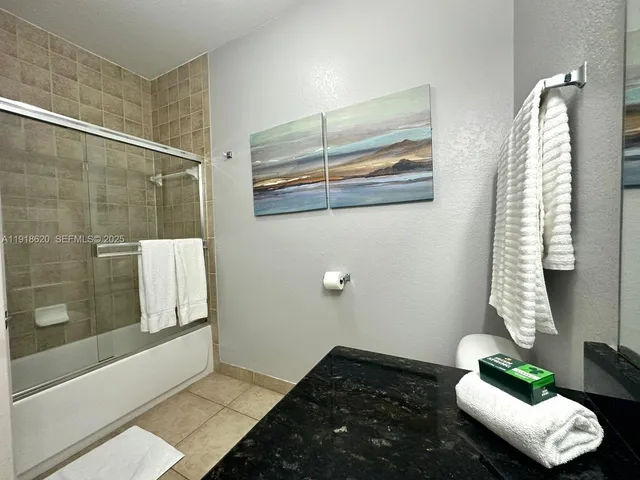 a bathroom with a tub and shower