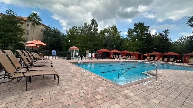 a view of a house with garden and sitting area