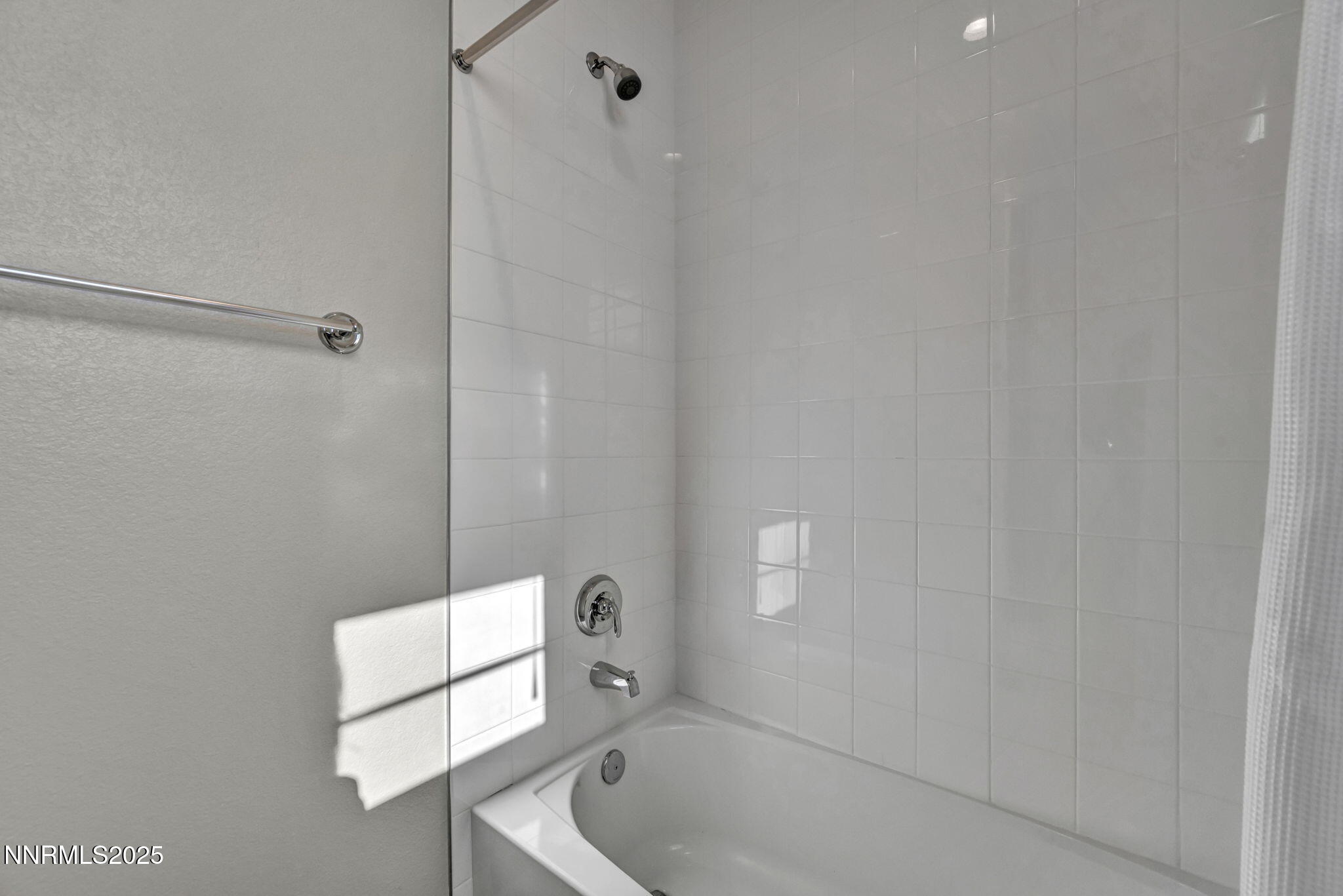 9267 Blue Basin Trail Reno, NV 89521 - Photo 39 of 68 a bathroom with a tub and shower