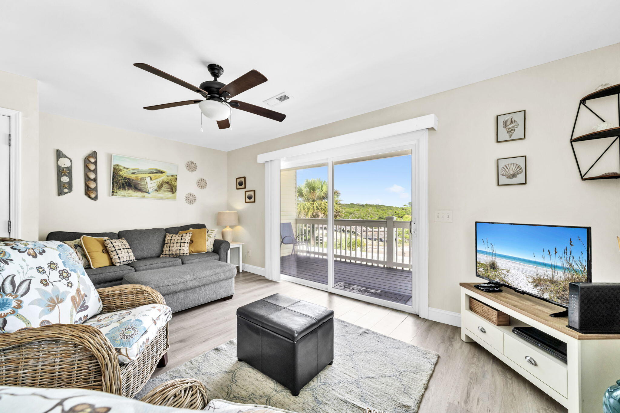 228 Walton Magnolia Lane, Unit 4 Inlet Beach, FL 32461 - Photo 5 of 45 a living room with furniture and a flat screen tv