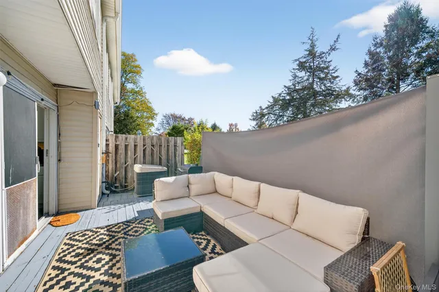 a backyard of a house with sofas