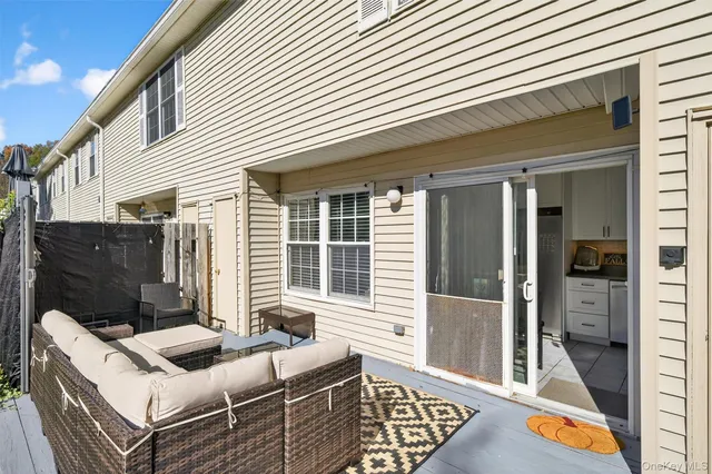 a view of house with a backyard