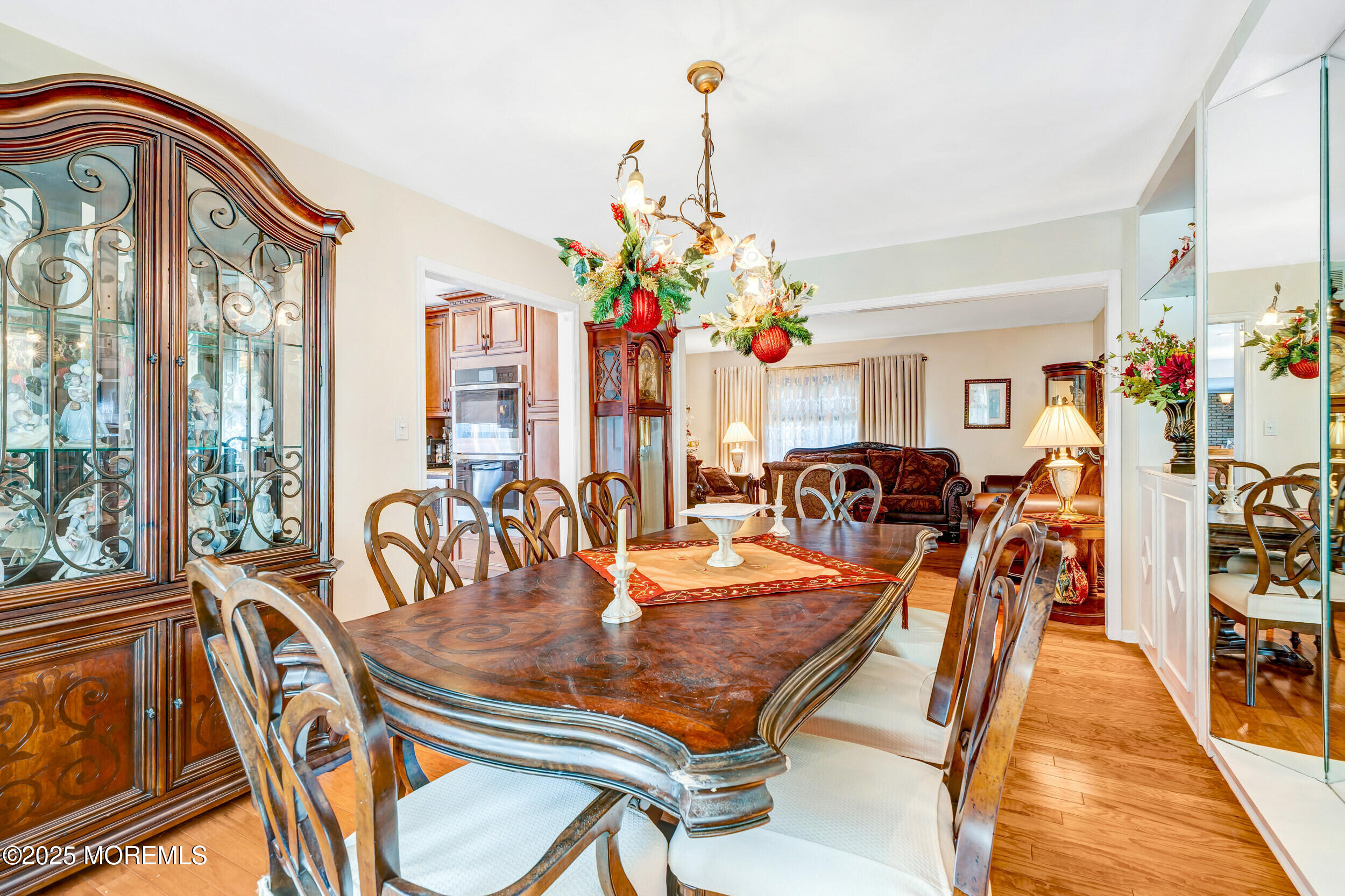 7 Oak Tree Lane Asbury Park, NJ 07712 - Photo 15 of 45 a dining room filled with furniture and chandelier