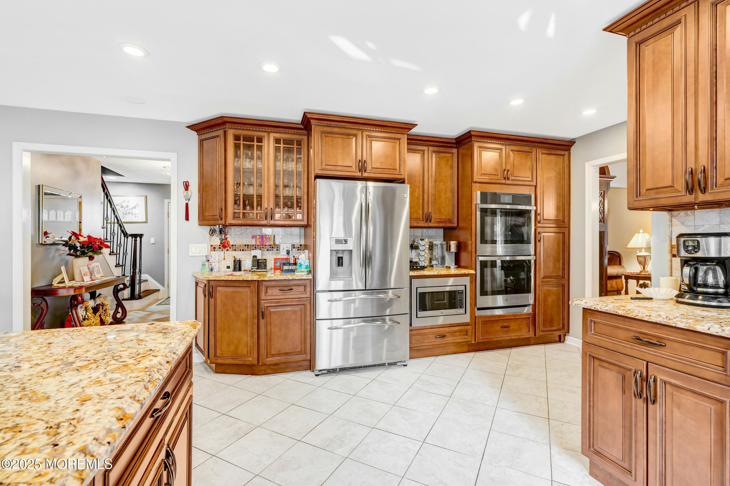 7 Oak Tree Lane Asbury Park, NJ 07712 - Photo 17 of 45 a kitchen with stainless steel appliances granite countertop a refrigerator and a stove top oven