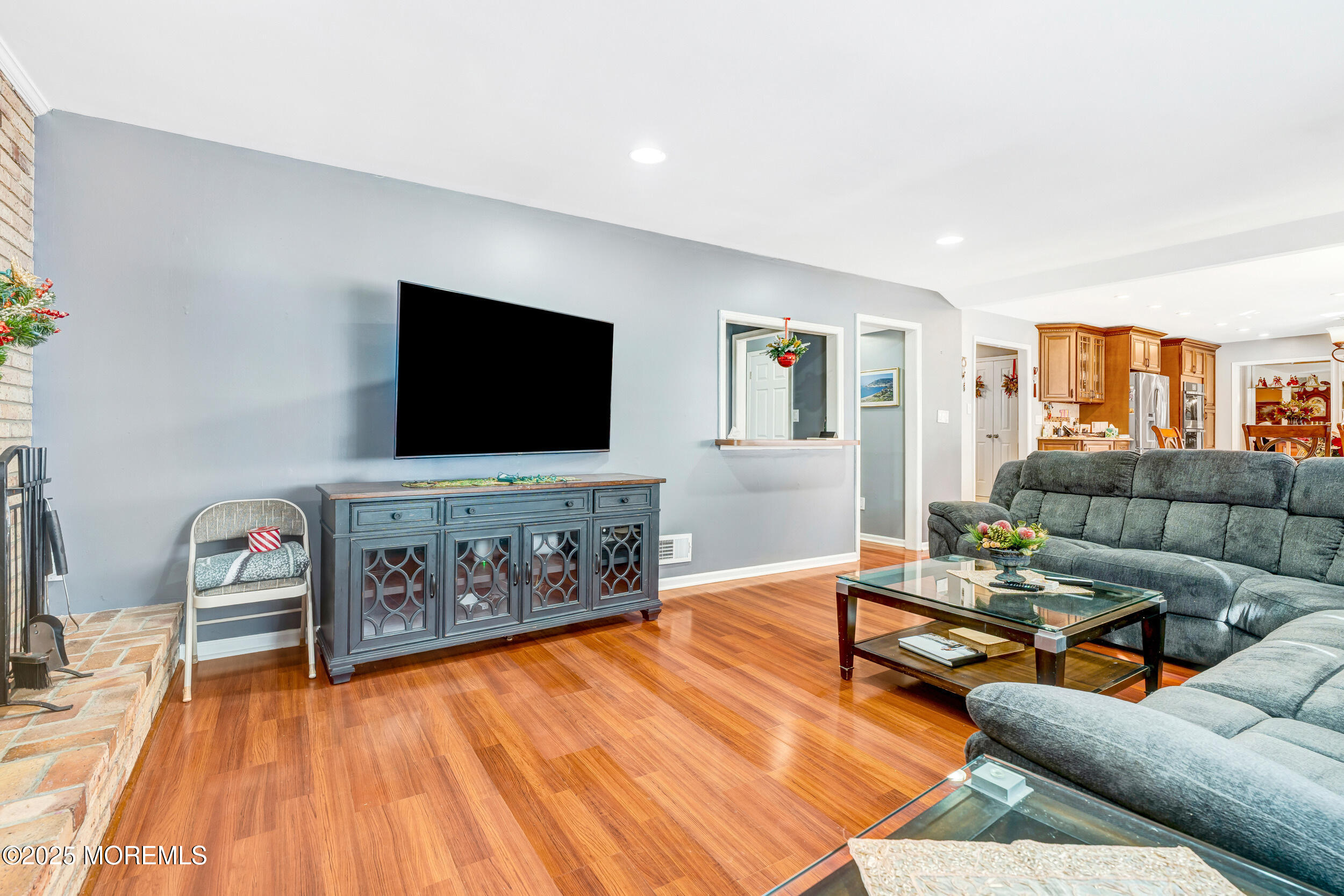 7 Oak Tree Lane Asbury Park, NJ 07712 - Photo 24 of 45 a living room with furniture and a flat screen tv