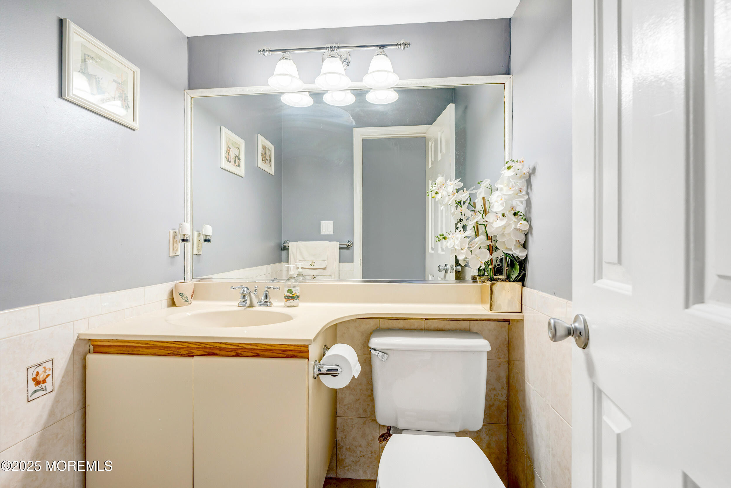7 Oak Tree Lane Asbury Park, NJ 07712 - Photo 26 of 45 a bathroom with a toilet sink and mirror