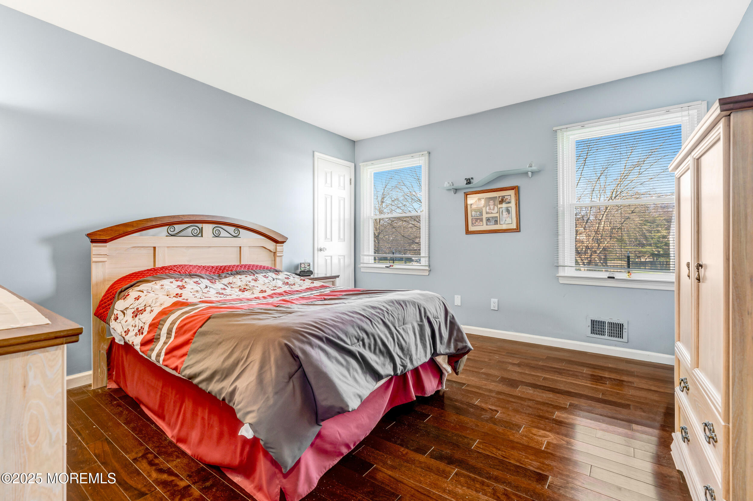 7 Oak Tree Lane Asbury Park, NJ 07712 - Photo 30 of 45 a bedroom with a bed and a window