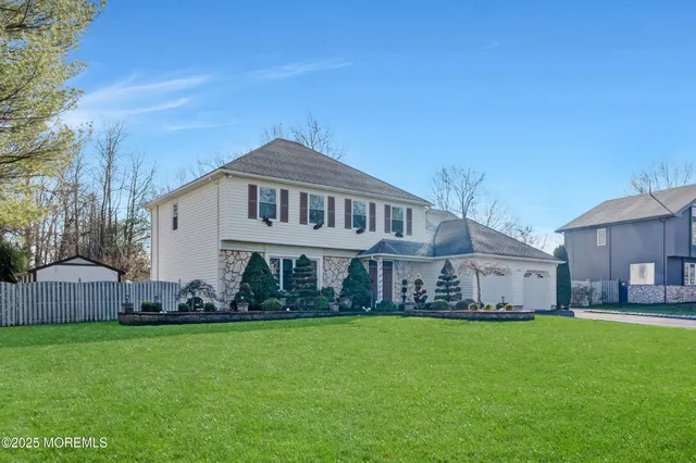 a view of a house with a big yard