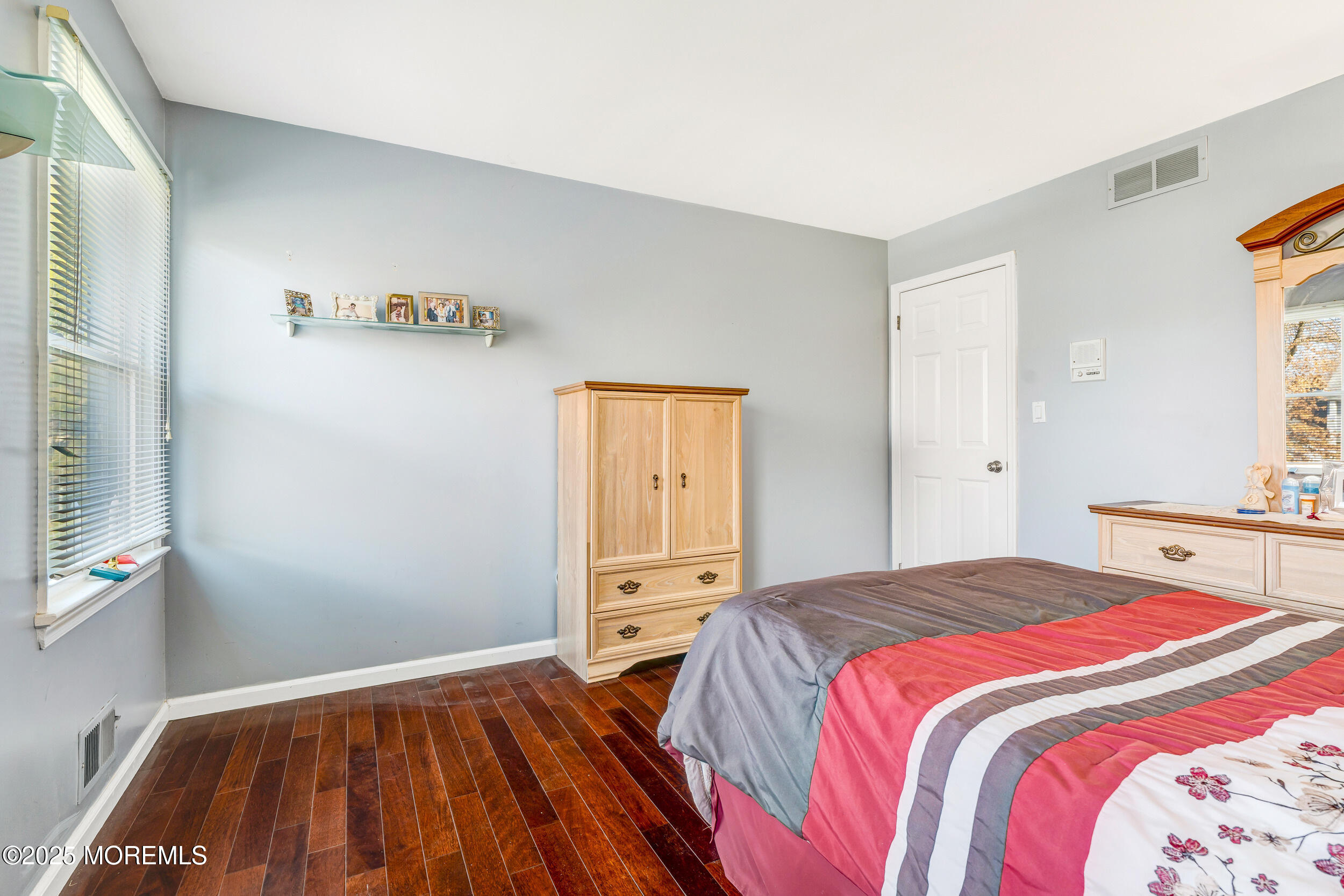 7 Oak Tree Lane Asbury Park, NJ 07712 - Photo 31 of 45 a bedroom with a bed and a window