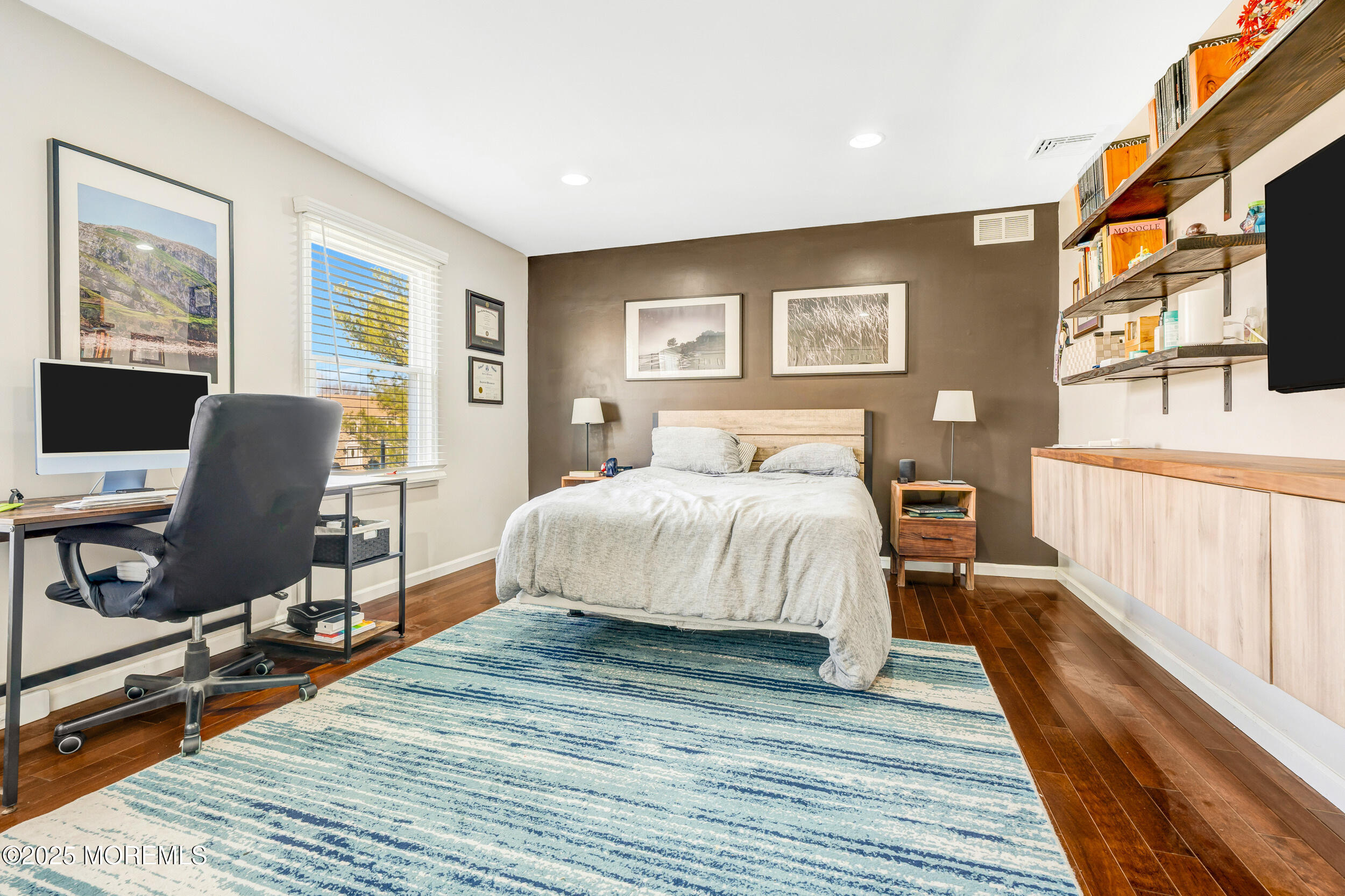 7 Oak Tree Lane Asbury Park, NJ 07712 - Photo 32 of 45 a bedroom with a bed and wooden floor