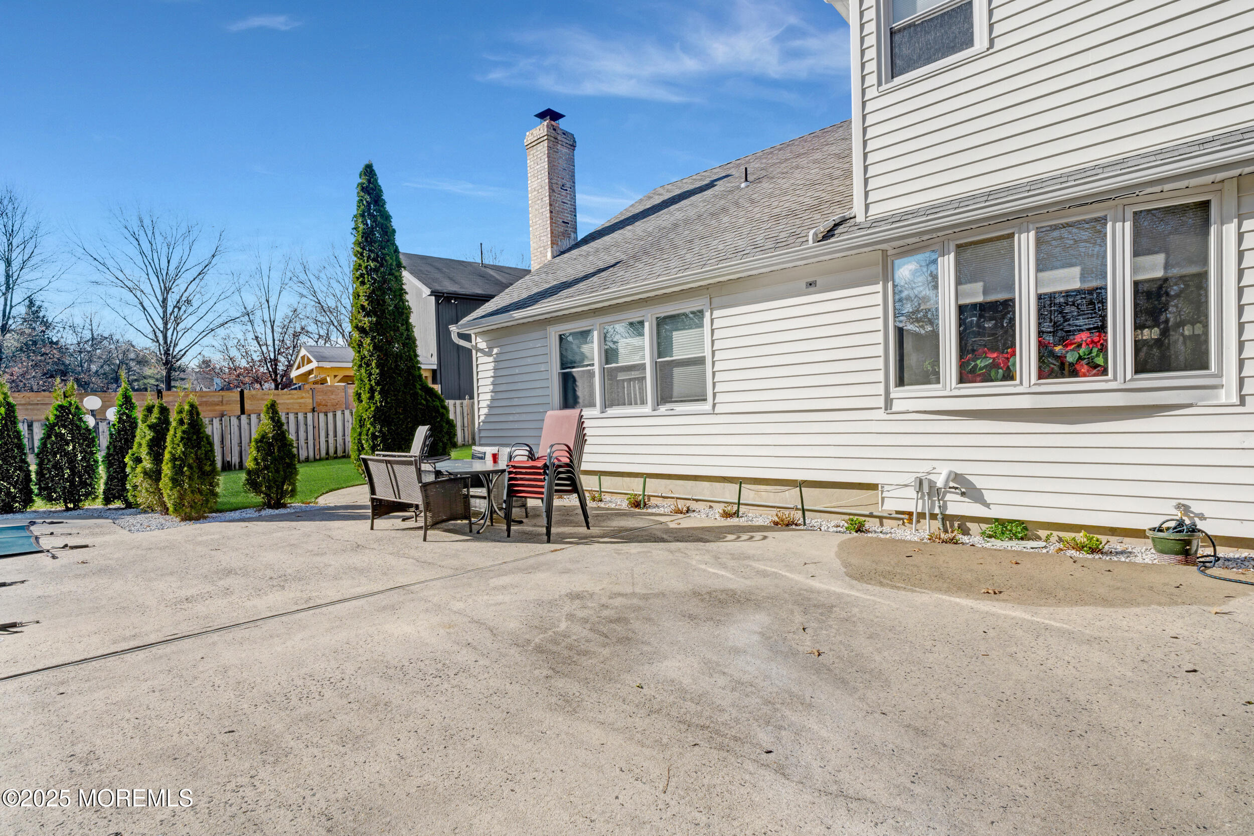 7 Oak Tree Lane Asbury Park, NJ 07712 - Photo 43 of 45 a view of a house with sitting area and chair