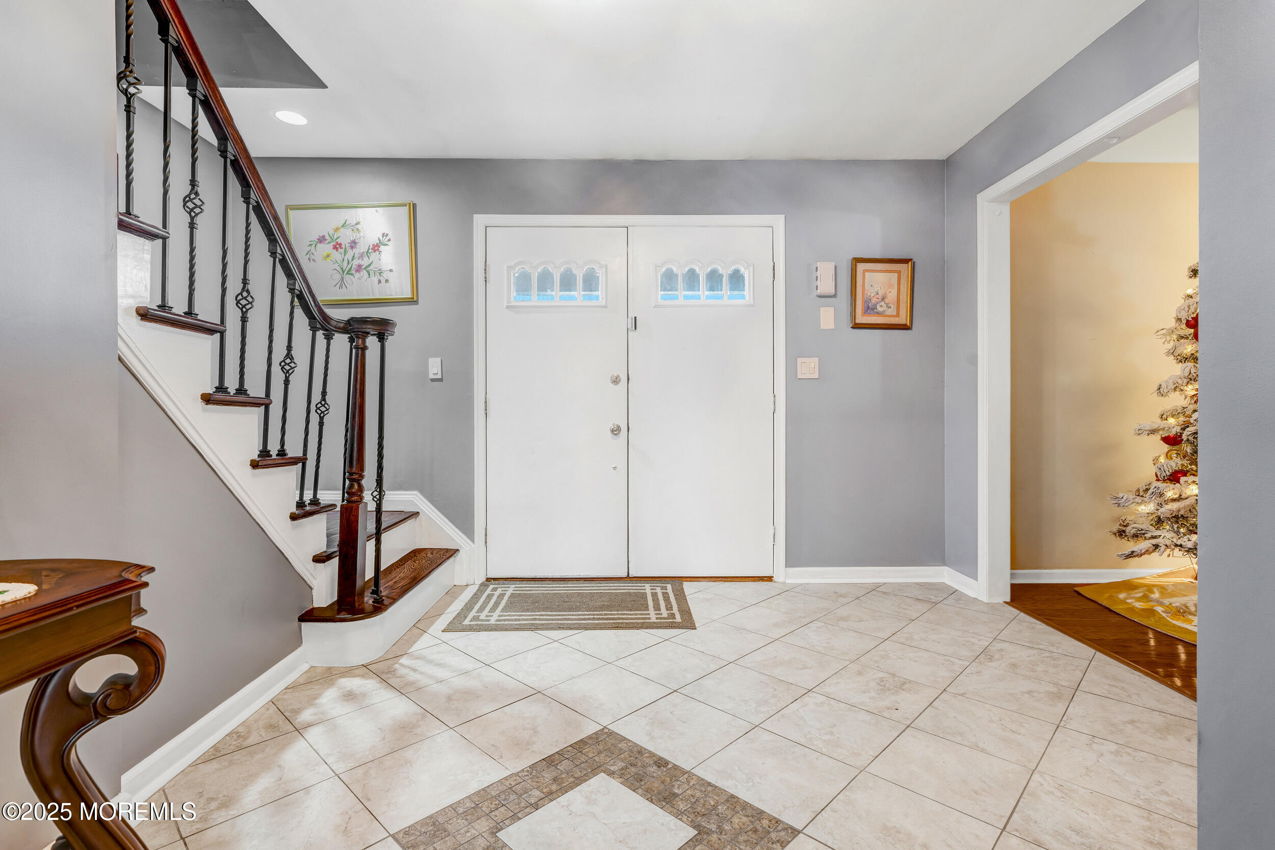7 Oak Tree Lane Asbury Park, NJ 07712 - Photo 8 of 45 a view of an entryway with staircase