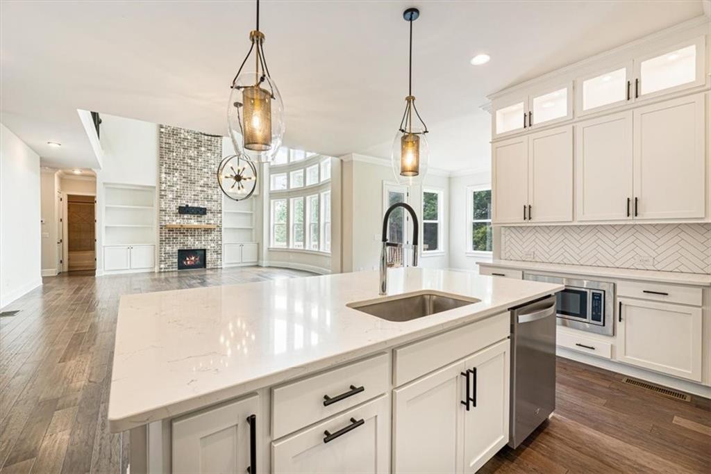 947 Hunter Way Milton, GA 30004 - Photo 34 of 78 a kitchen with cabinets a sink and appliances