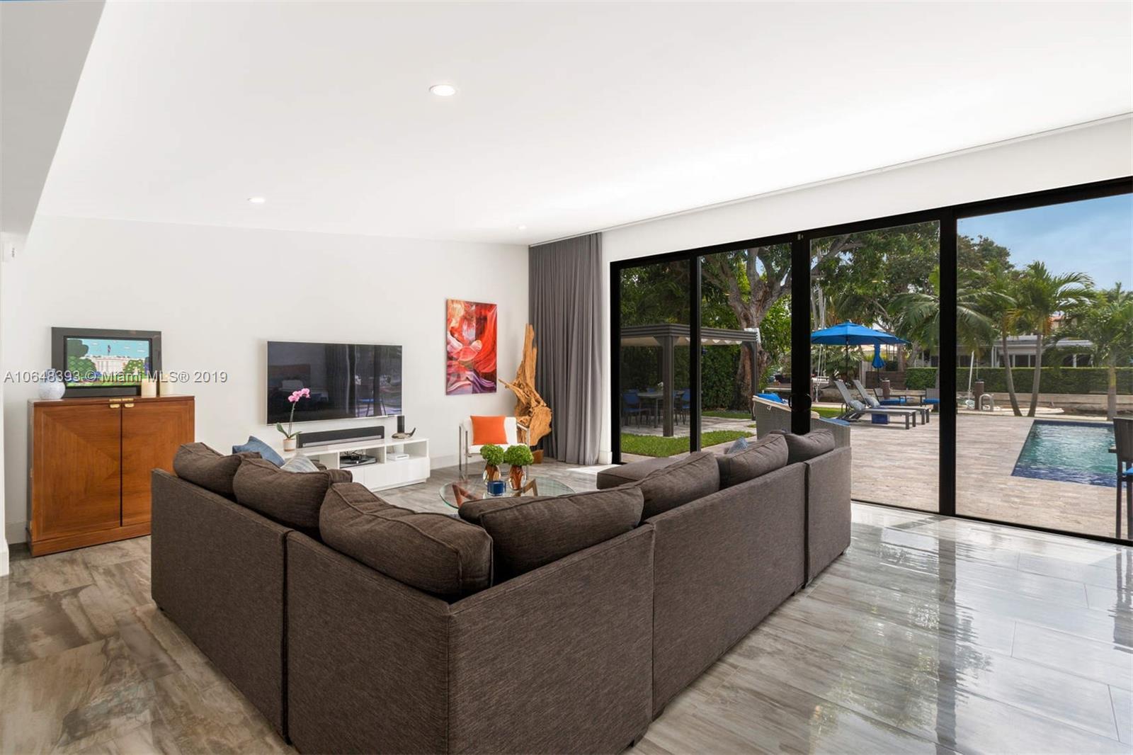 1880 Cleveland Road Miami Beach, FL 33141 - Photo 14 of 26 a living room with furniture and a flat screen tv