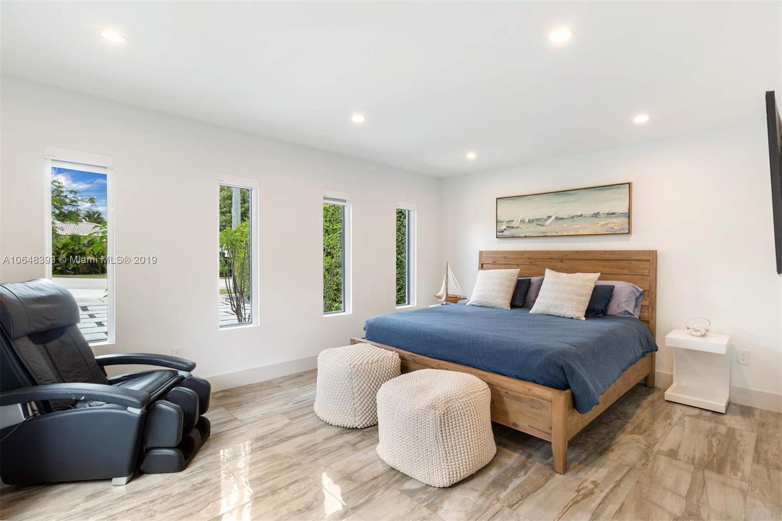 1880 Cleveland Road Miami Beach, FL 33141 - Photo 16 of 26 a bedroom with a bed and wooden floor