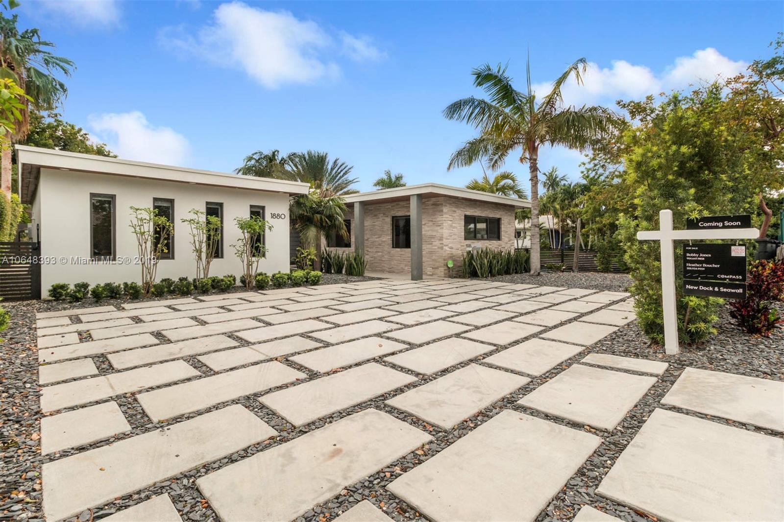 1880 Cleveland Road Miami Beach, FL 33141 - Photo 2 of 26 a front view of a house with a yard and potted plants