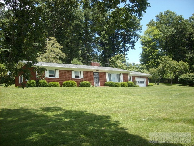 2195 Deerfield Road Boone, NC 28607 - Photo 1 of 19 a front view of a house with a garden