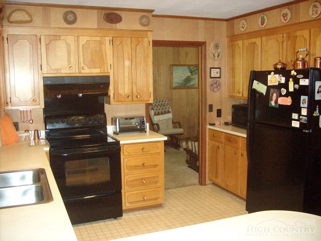 2195 Deerfield Road Boone, NC 28607 - Photo 12 of 19 a kitchen with a refrigerator and a stove