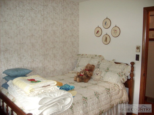 2195 Deerfield Road Boone, NC 28607 - Photo 4 of 19 a close up of a bed in a bedroom