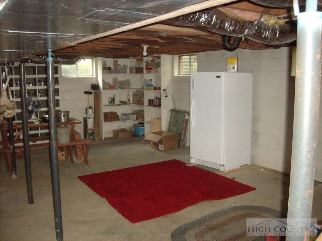 2195 Deerfield Road Boone, NC 28607 - Photo 6 of 19 a view of walk in closet with clothes and shoes