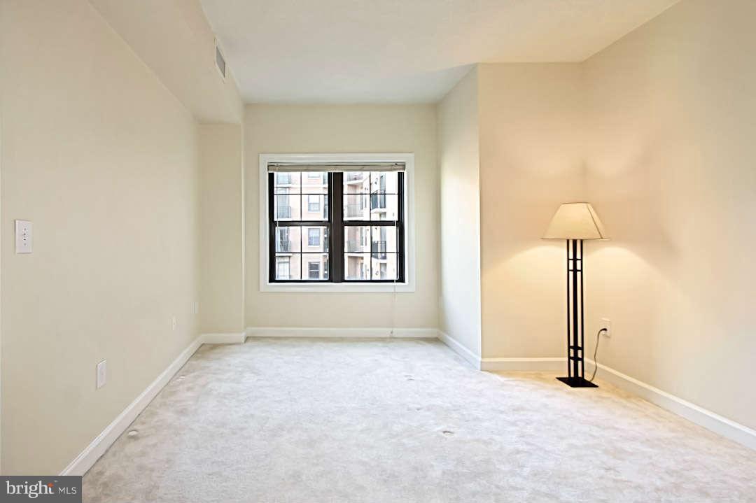1111 25th Street Northwest, Unit 714 Washington, DC 20037 - Photo 19 of 28 an empty room with windows