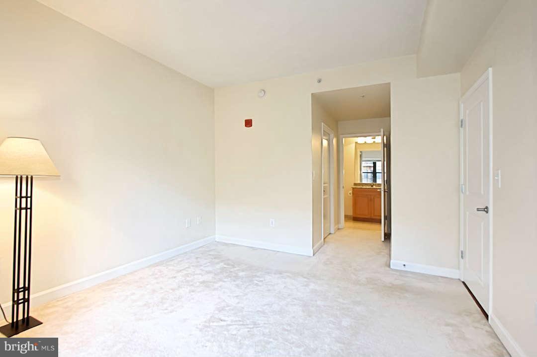 1111 25th Street Northwest, Unit 714 Washington, DC 20037 - Photo 20 of 28 a view of an empty room and a bathroom