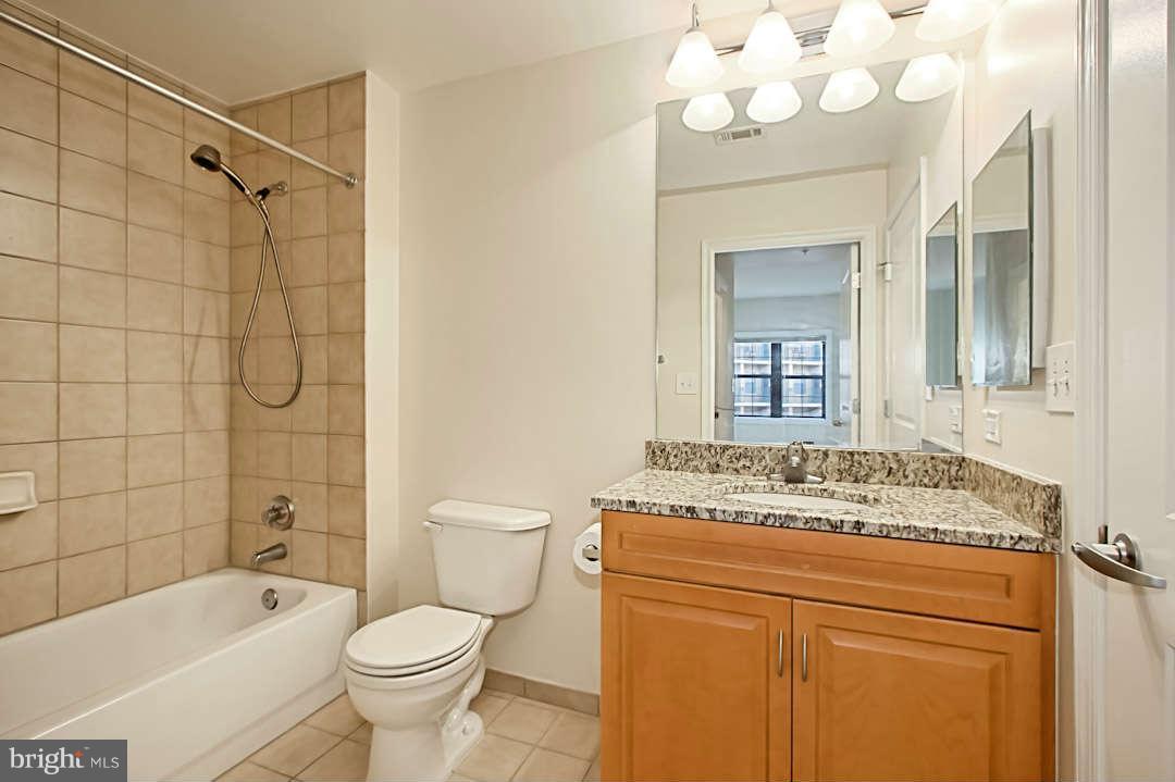 1111 25th Street Northwest, Unit 714 Washington, DC 20037 - Photo 21 of 28 a bathroom with a sink a toilet and shower