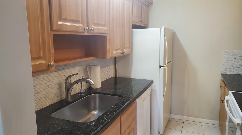 3910 Crystal Lake Drive, Unit 403 Deerfield Beach, FL 33064 - Photo 16 of 27 a bathroom with a granite countertop sink and a mirror