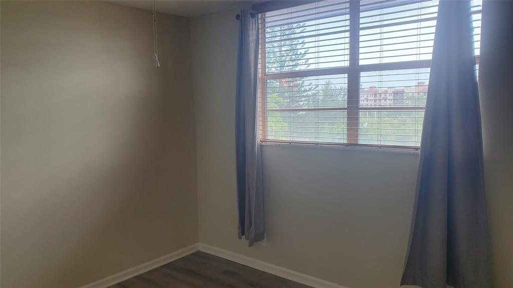 3910 Crystal Lake Drive, Unit 403 Deerfield Beach, FL 33064 - Photo 20 of 27 a small space with a window