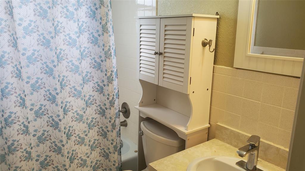 3910 Crystal Lake Drive, Unit 403 Deerfield Beach, FL 33064 - Photo 22 of 27 a bathroom with a shower and a sink