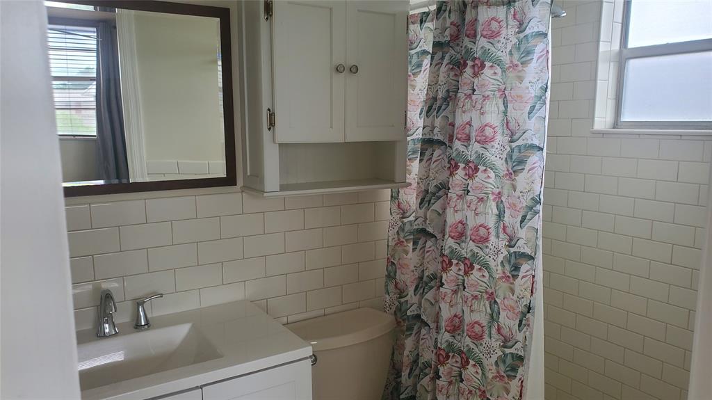 3910 Crystal Lake Drive, Unit 403 Deerfield Beach, FL 33064 - Photo 25 of 27 a bathroom with a shower and a sink