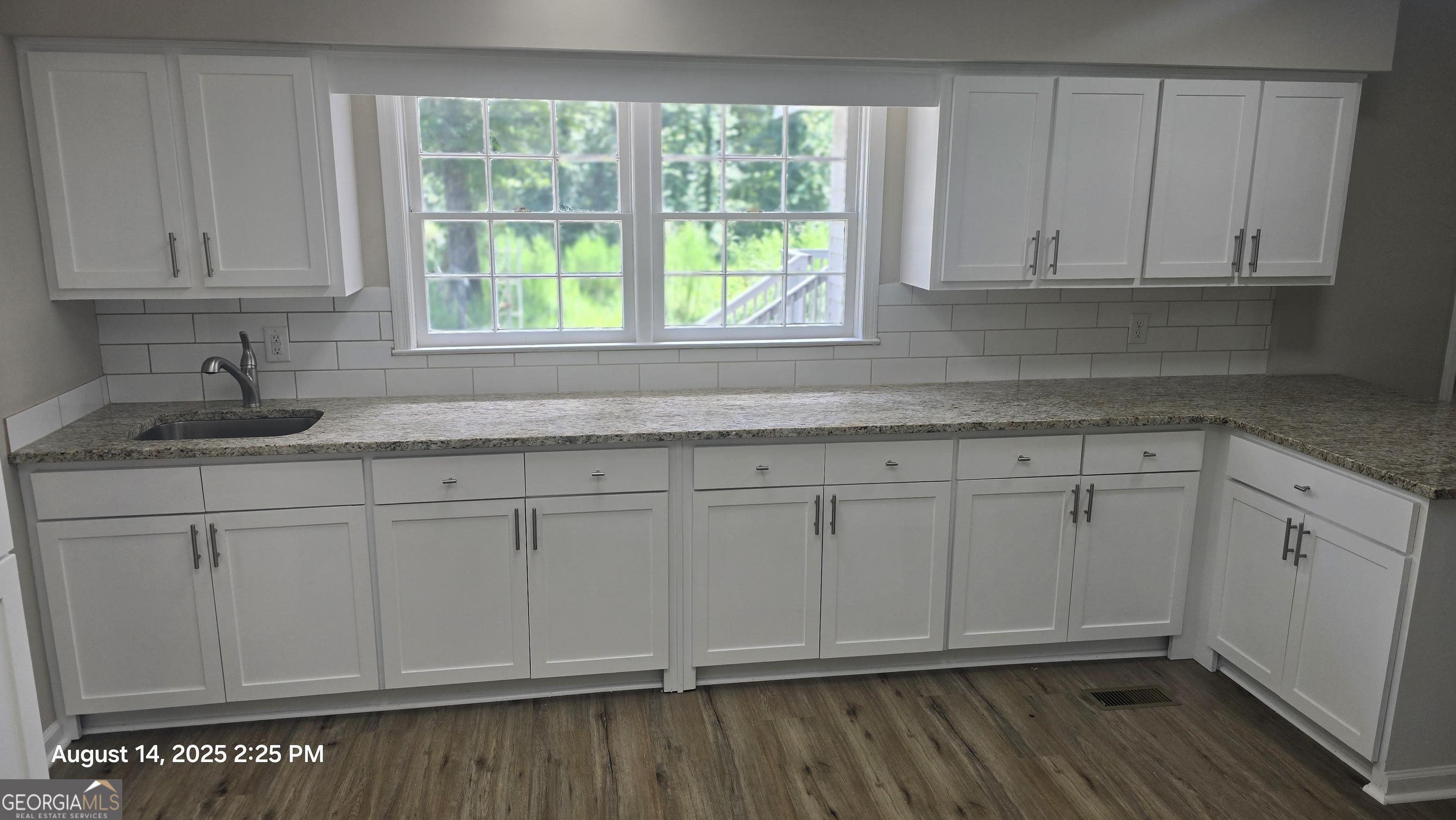 601 Youngs Mill Road Americus, GA 31719 - Photo 12 of 39 a kitchen with granite countertop white cabinets and sink