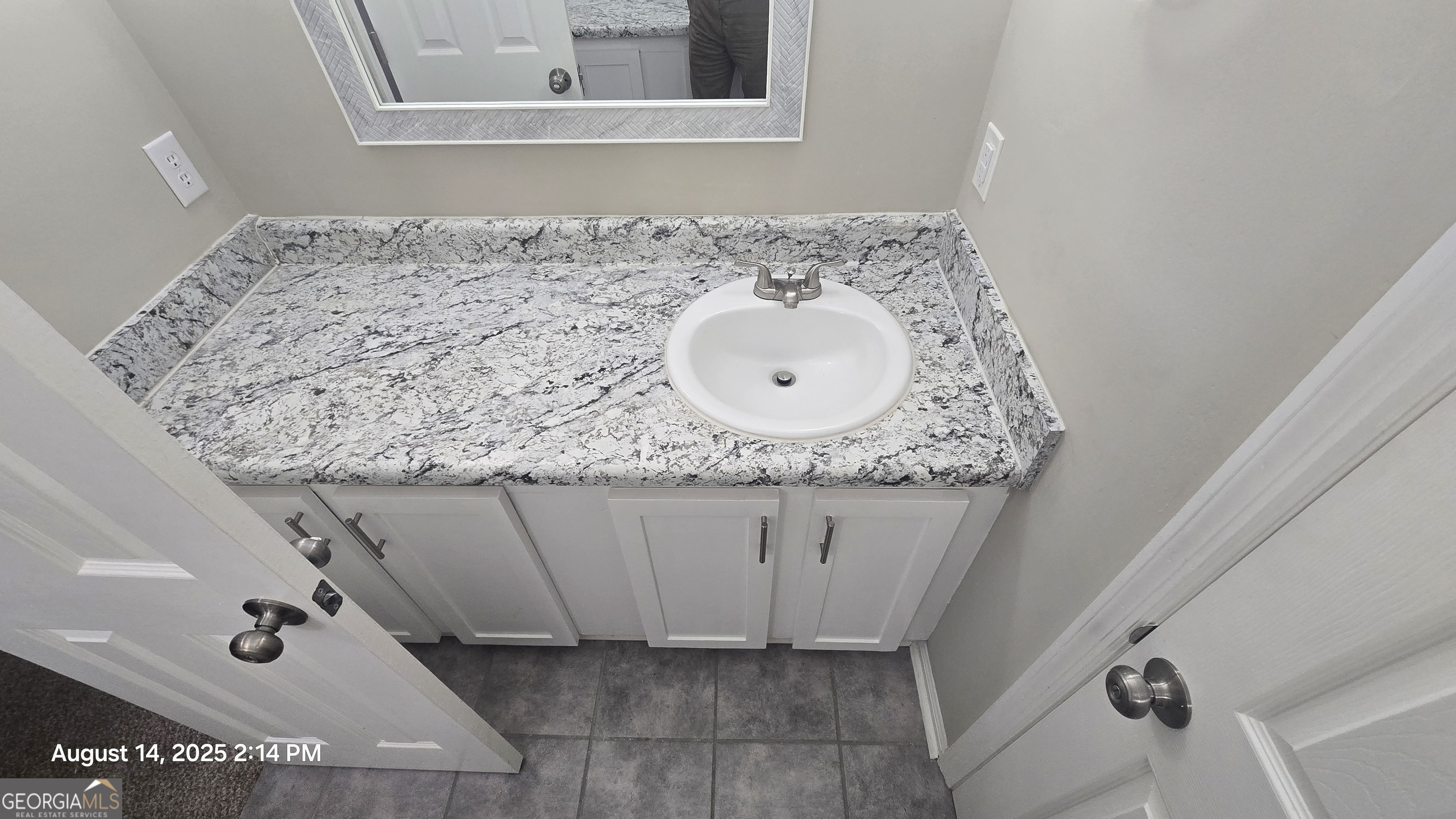 601 Youngs Mill Road Americus, GA 31719 - Photo 27 of 39 a bathroom with a granite countertop sink and a mirror