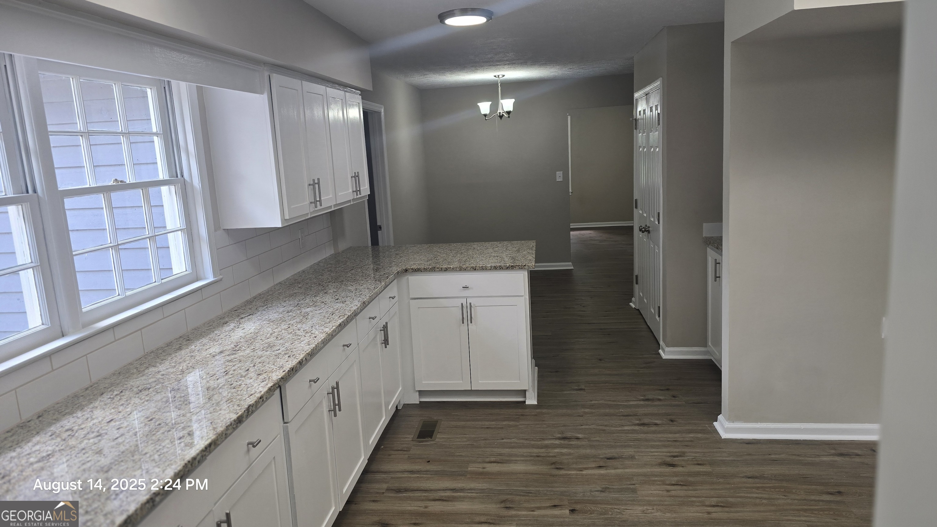 601 Youngs Mill Road Americus, GA 31719 - Photo 5 of 39 a bathroom with a granite countertop sink a toilet and a large mirror