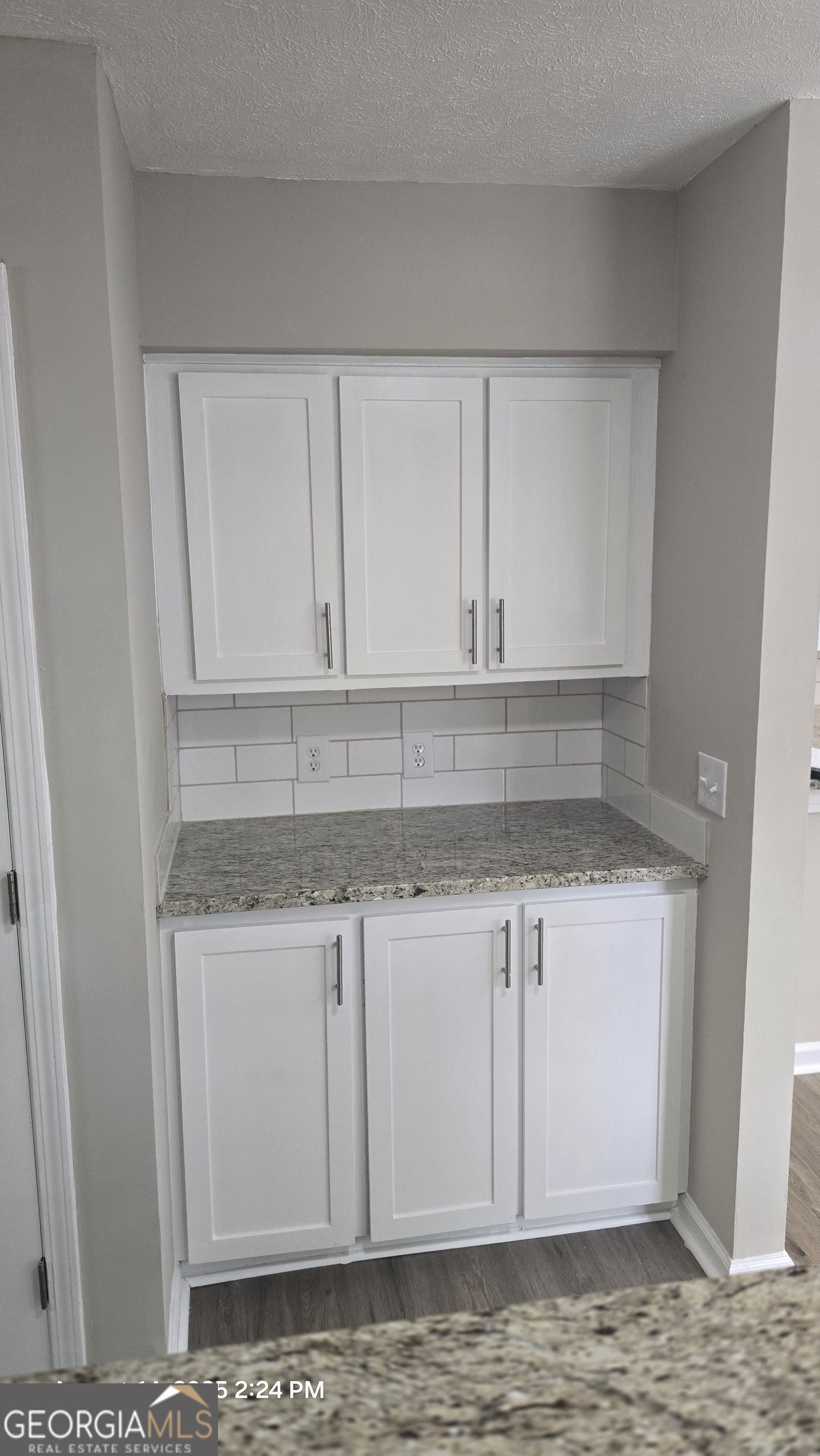 601 Youngs Mill Road Americus, GA 31719 - Photo 8 of 39 a kitchen with granite countertop white cabinets and a sink