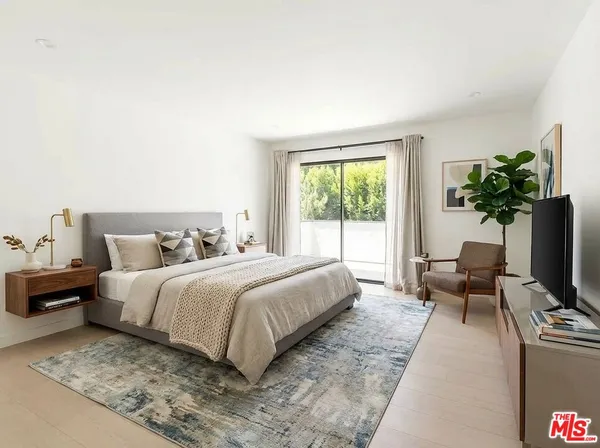 a bathroom with a shower sink vanity mirror and toilet