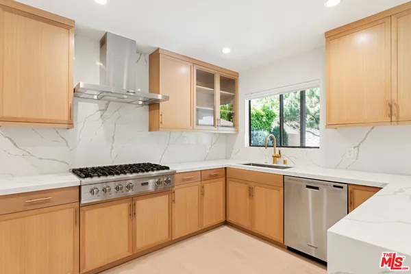 a dining room with furniture a chandelier and window