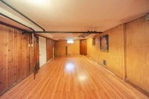 a view of walk in closet with wooden floor