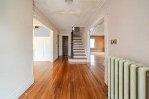 a view of hallway with wooden floor
