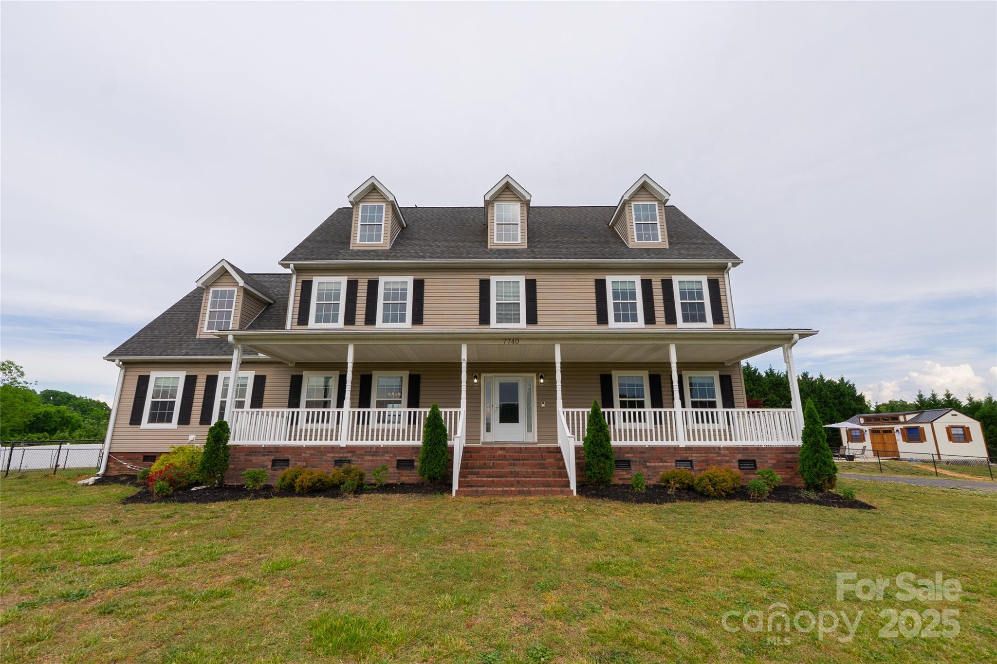 7740 Freeze Road Kannapolis, NC 28081 - Photo 1 of 43 a big house with a large window and yard