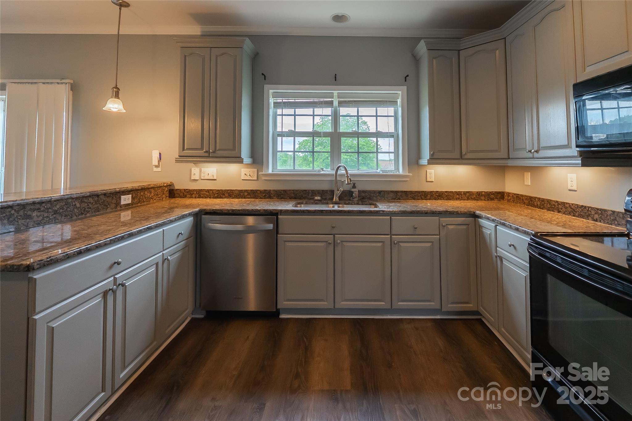 7740 Freeze Road Kannapolis, NC 28081 - Photo 15 of 43 a kitchen with a sink stove and cabinets