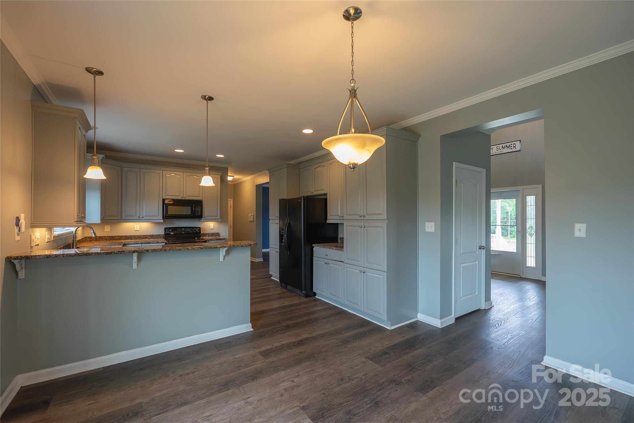 7740 Freeze Road Kannapolis, NC 28081 - Photo 17 of 43 a view of a kitchen with a sink and a wooden floor