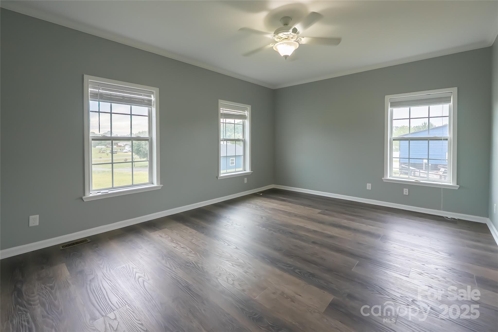 7740 Freeze Road Kannapolis, NC 28081 - Photo 22 of 43 a view of an empty room with wooden floor and a window