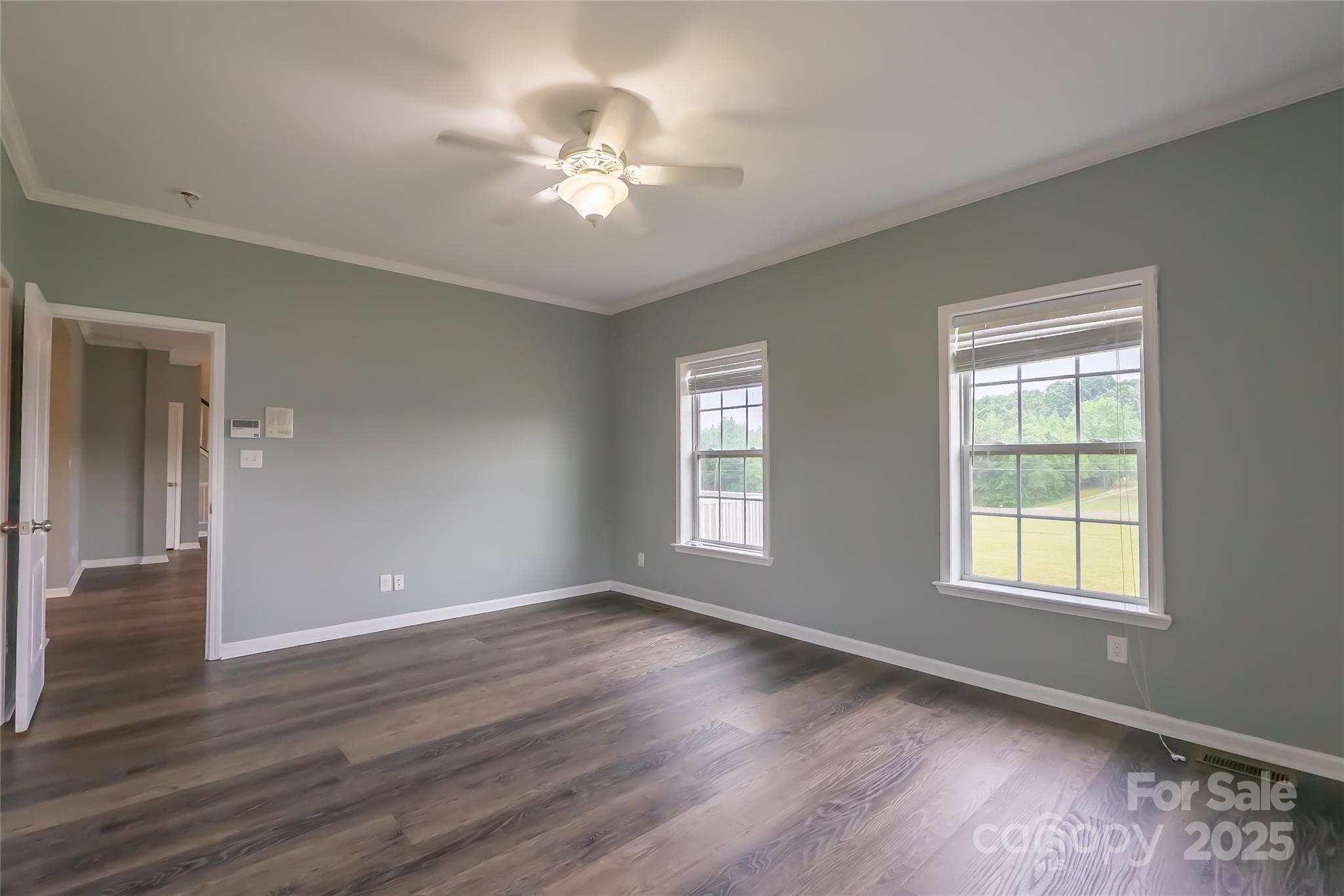 7740 Freeze Road Kannapolis, NC 28081 - Photo 23 of 43 a view of an empty room with wooden floor and a window