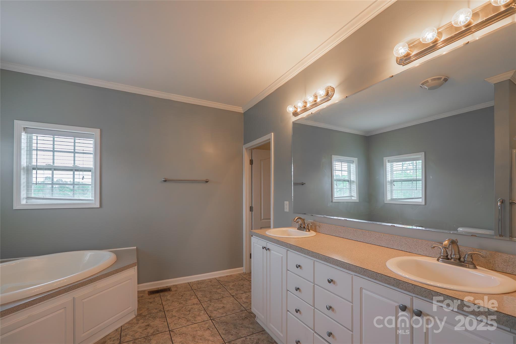 7740 Freeze Road Kannapolis, NC 28081 - Photo 24 of 43 a bathroom with a granite countertop sink mirror vanity and toilet