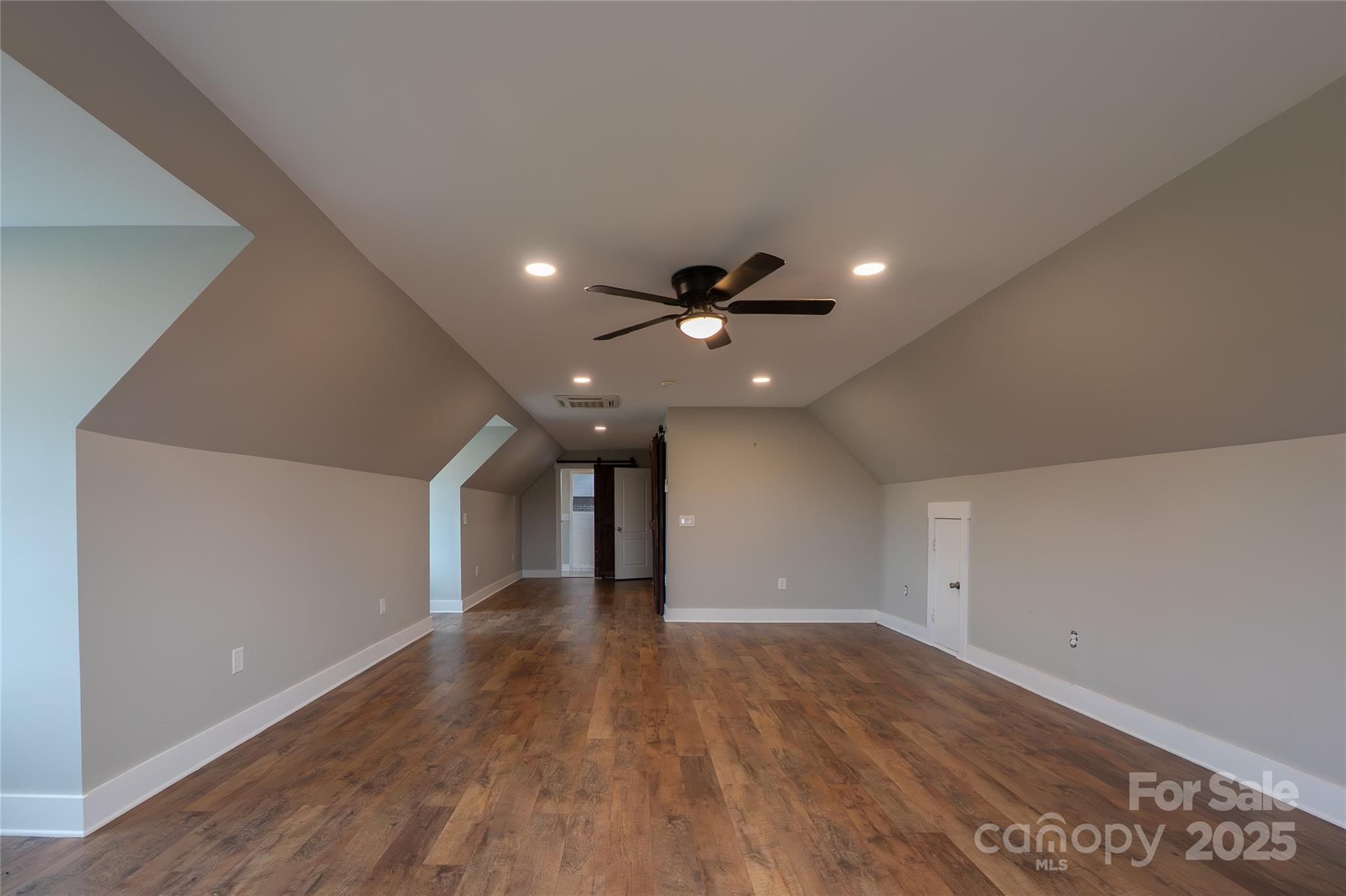 7740 Freeze Road Kannapolis, NC 28081 - Photo 38 of 43 a view of an empty room with wooden floor