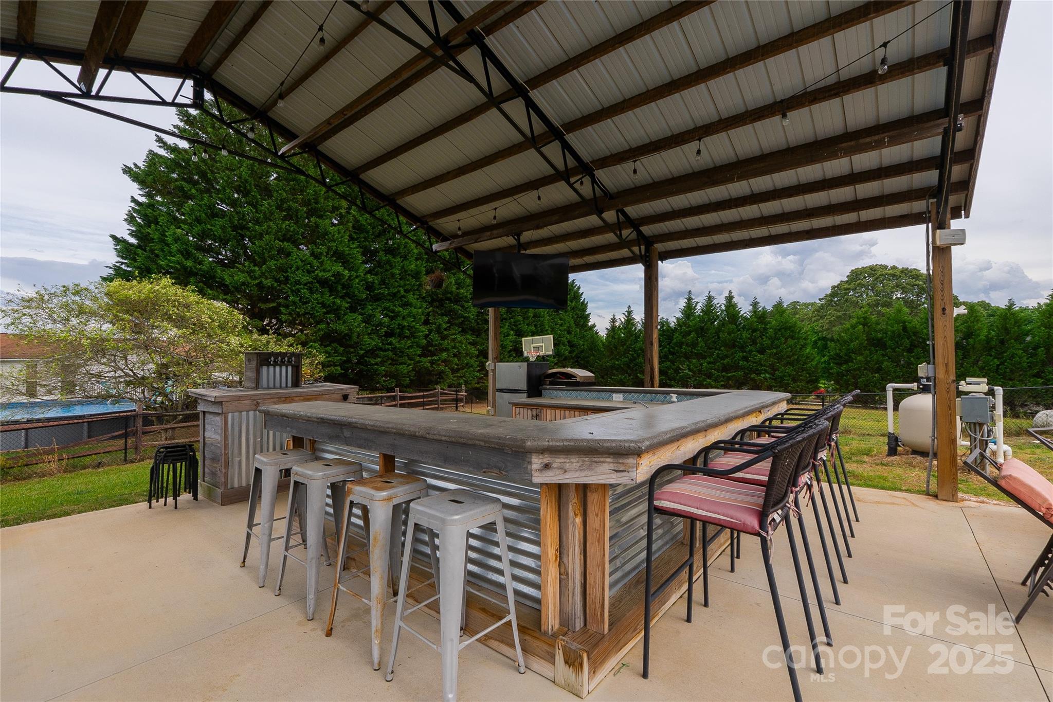 7740 Freeze Road Kannapolis, NC 28081 - Photo 8 of 43 a patio with a table and chairs