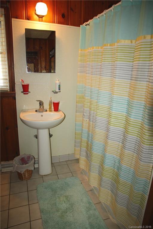 878 Sherwood Road Clover, SC 29710 - Photo 13 of 21 a bathroom with a sink a mirror and shower